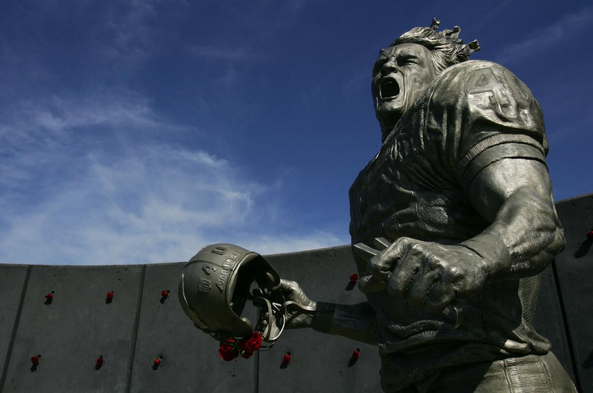 A statue of Pat Tillman stands outside State Farm Stadium in Glendale, Ariz.