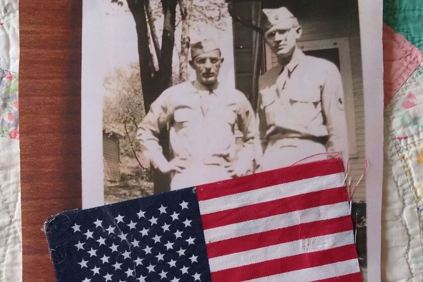 The young men in the picture are the author's father (right) and his brother in Indiana during World War II. 