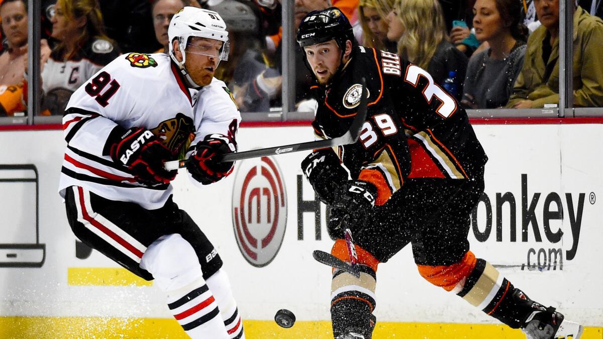 Ducks forward Matt Beleskey (39) knocks the puck past Chicago Blackhawks forward Brad Richards during Game 2 of the Western Conference finals at Honda Center on May 19, 2015.