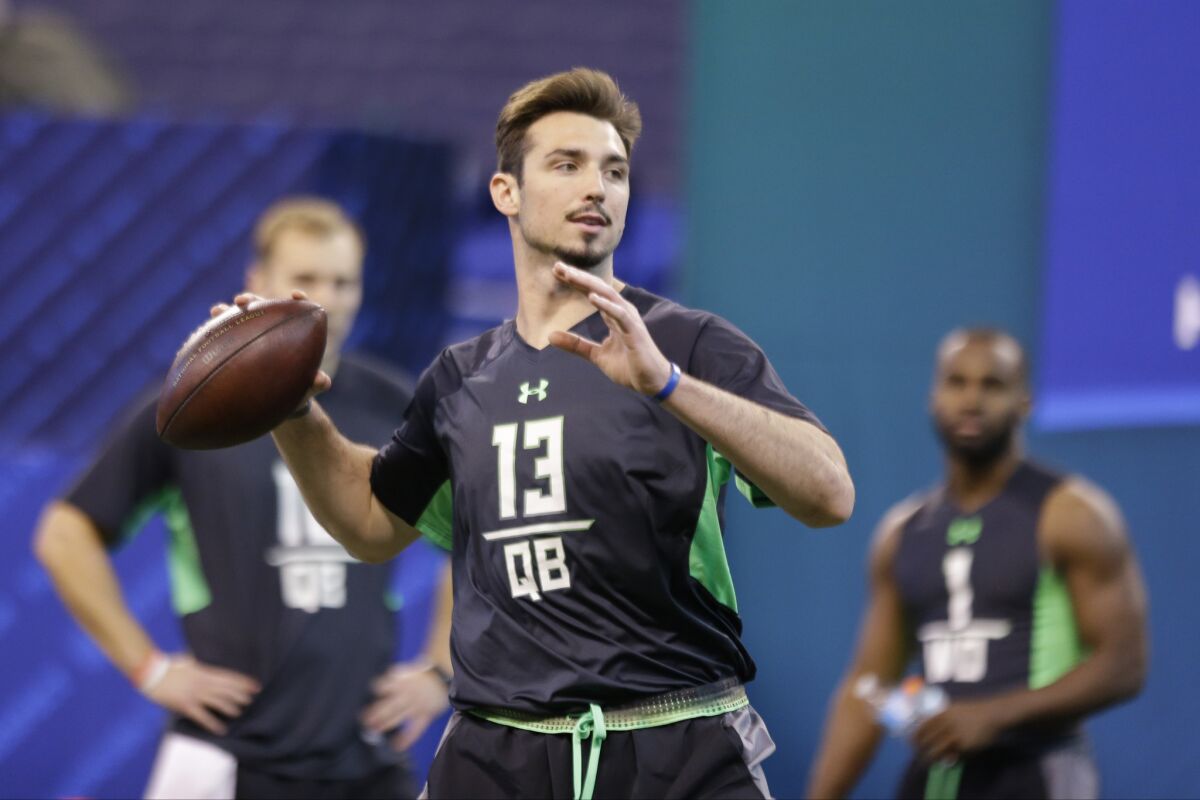Memphis quarterback Paxton Lynch looks to throw a pass during a drill at the NFL scouting combine on Feb. 27.