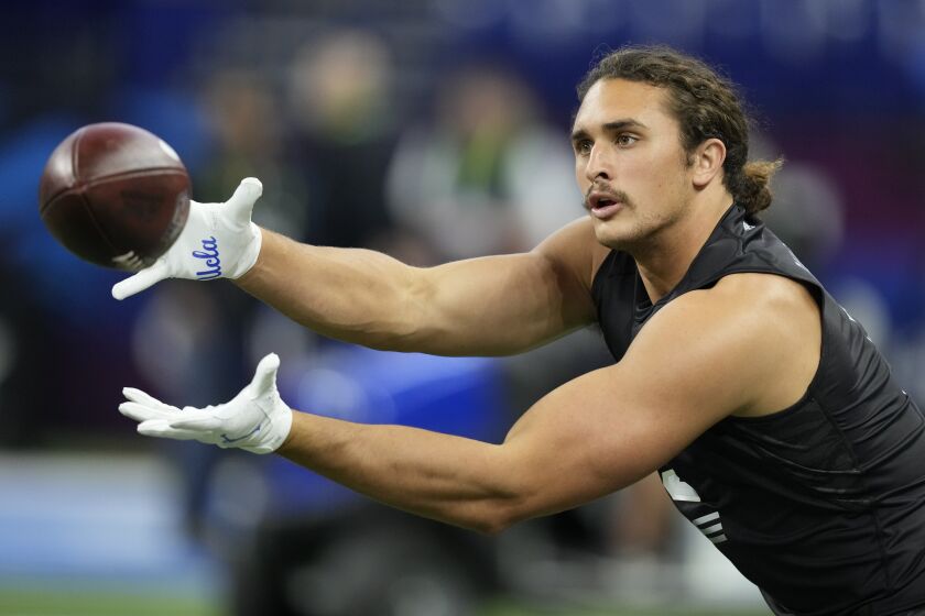 UCLA tight end Greg Dulcich catches a pass at the NFL football scouting combine, Thursday, March 3, 2022, in Indianapolis. (AP Photo/Charlie Neibergall)