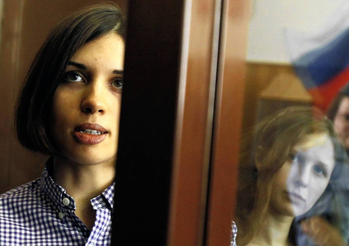 Nadezhda Tolokonnikova, left, pictured in a courtroom cage last year with Pussy Riot bandmate Maria Alyokhina, has not been heard from for three weeks, her husband says.