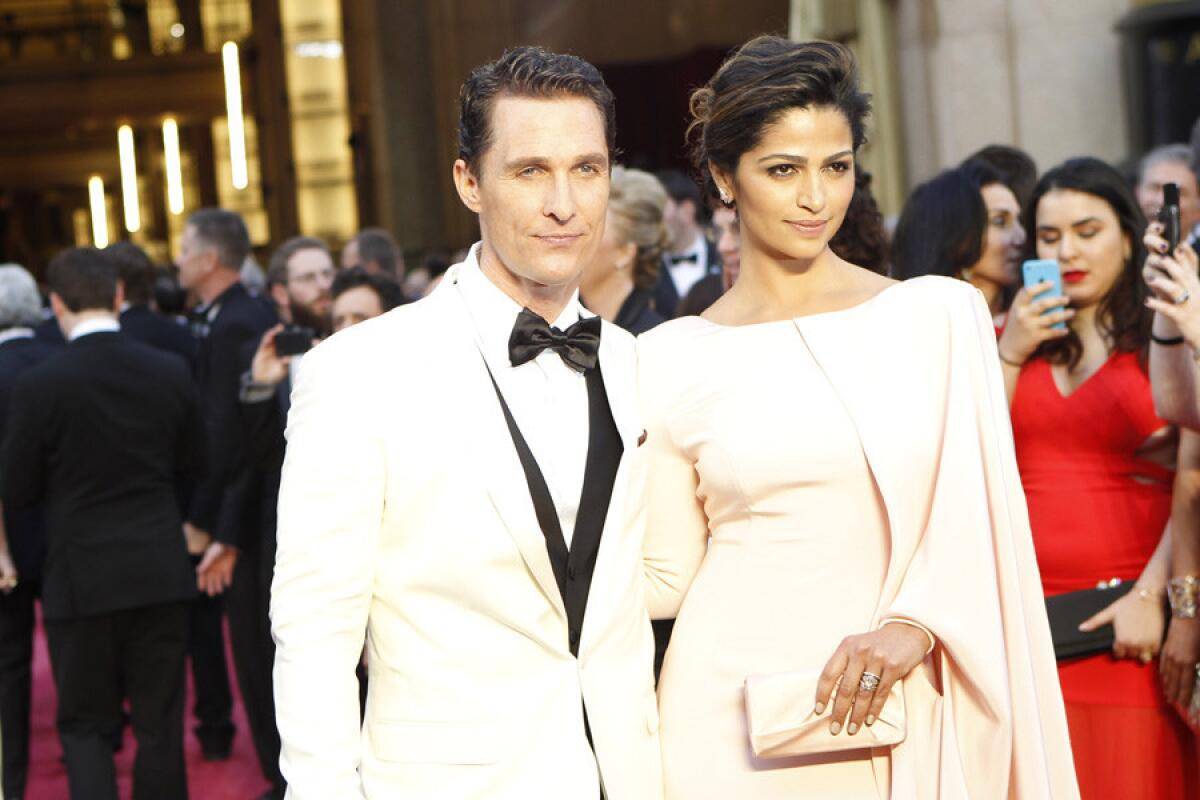 Matthew McConaughey and Camila Alves on the red carpet. Alves' look evokes "classic Hollywood with a modern twist."