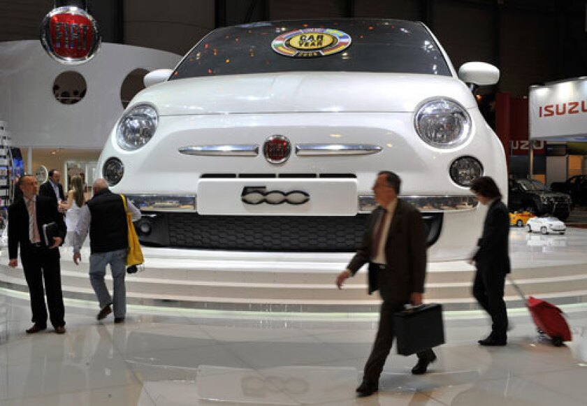 A Godzilla-sized Fiat 500 graces the exhibit hall at the Geneva Auto Show.