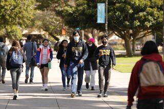 SANTA BARBARA, CA - NOVEMBER 09: Students on the UCSB campus in Santa Barbara as some students face a statewide student housing crisis. Some UC Santa Barbara students are forced to live in vehicles and hotels under temporary contracts due to expire next month. The crisis led the campus to move forward with a plan to build a massive 4,500-bed dorm with tiny rooms and few windows - dubbed "Dormzilla" - which sparked widespread student protests, national headlines and the resignation of the consulting architect. UC Santa Barbara on Tuesday, Nov. 9, 2021 in Santa Barbara, CA. (Al Seib / Los Angeles Times).