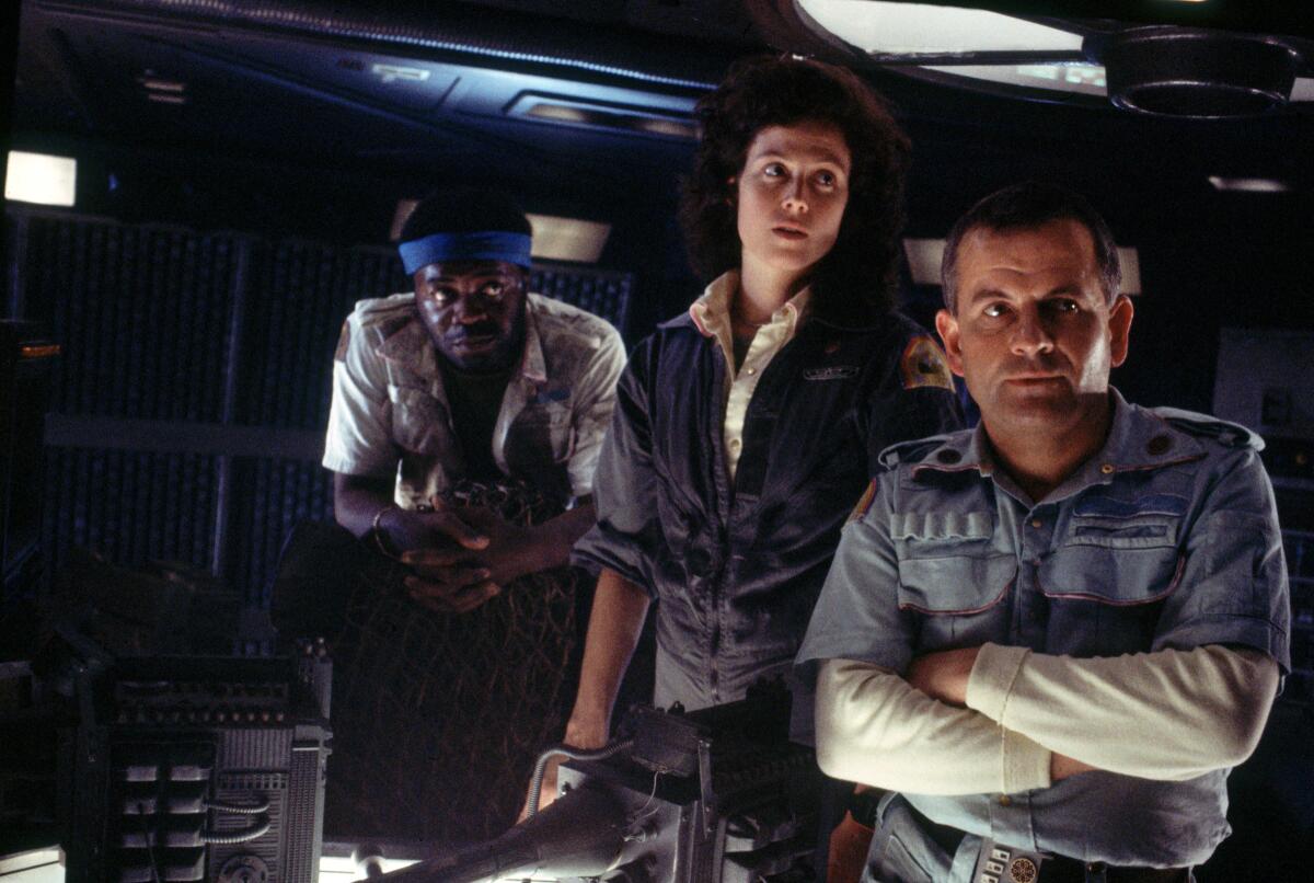 Yaphet Kotto, left, Sigourney Weaver and Ian Holm in the movie "Alien" (1979).