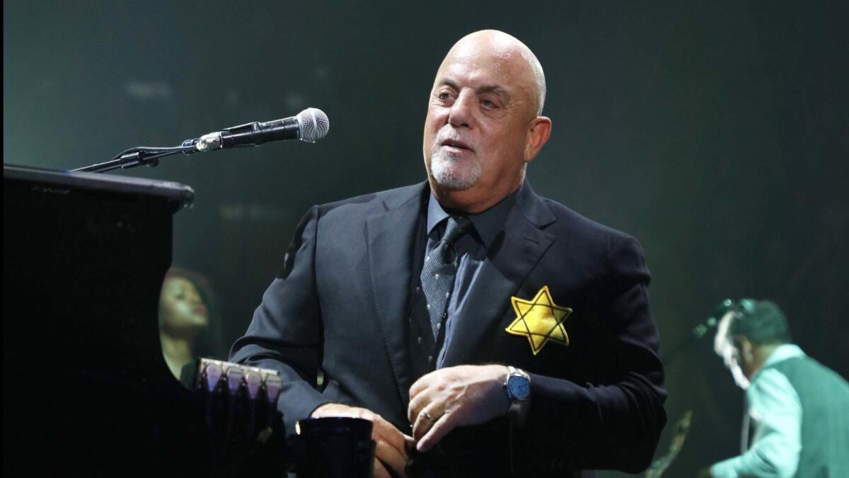 Billy Joel wears a jacket with a Star of David badge on the front — there was an identical badge on the back — at Madison Square Garden on Monday.