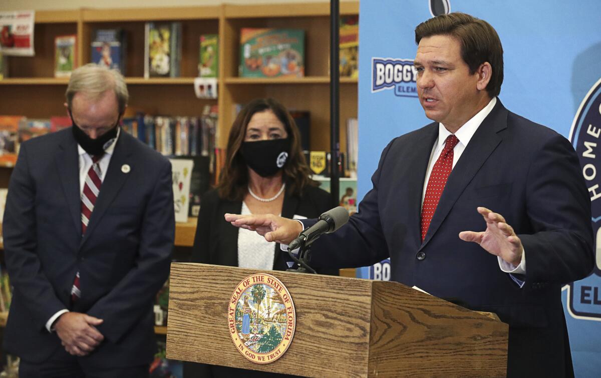 Florida Gov. Ron DeSantis speaks about education during the pandemic at a school in Kissimmee, Fla., on Nov. 30, 2020.