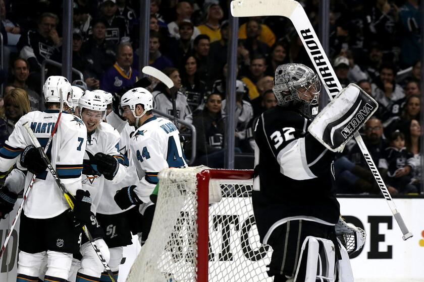 Sharks players celebrate a goal after center Tomas Hertl beat Kings goalie Jonathan Quick during the second period Thursday.