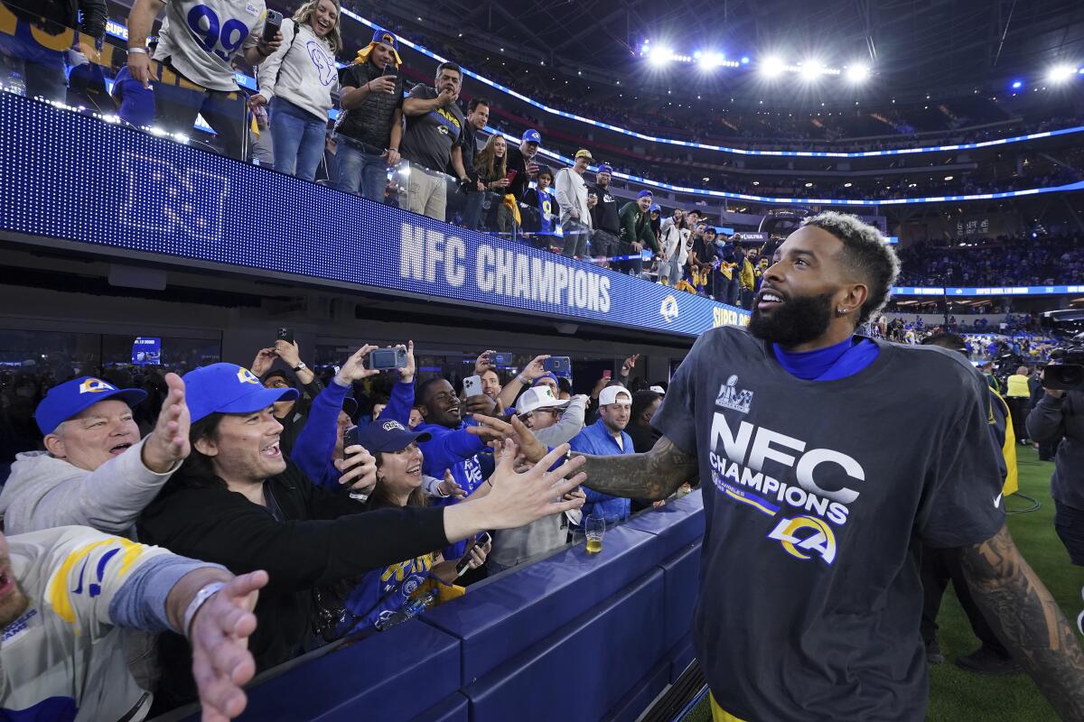 Rams wide receiver Odell Beckham Jr. celebrates with fans.