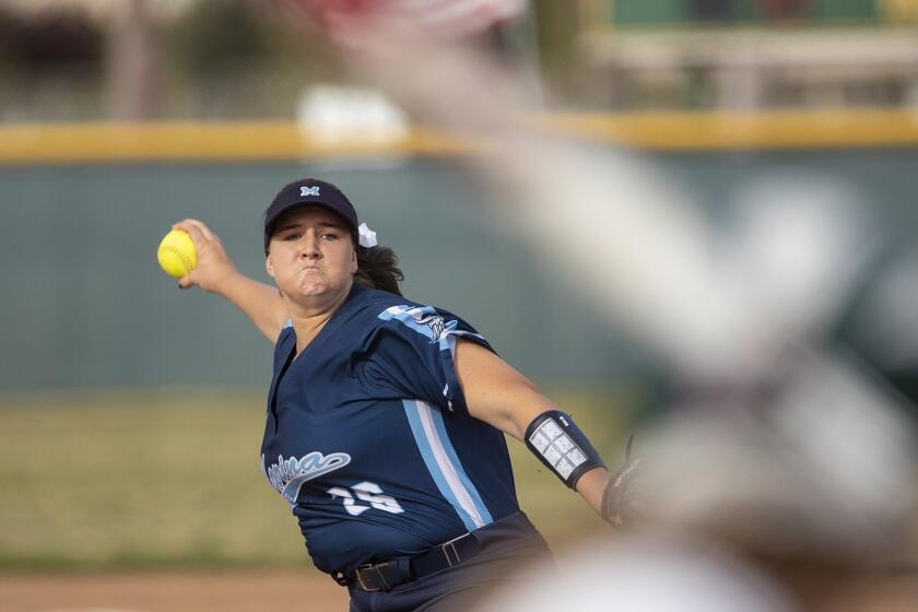 Marina's Emily Rush pitches during a Edison during a Surf League game against Edison on Thursday, April 11.