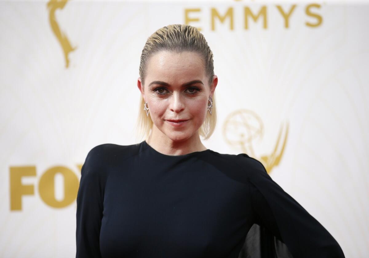 Taryn Manning is among the celebrities who beat the heat with slicked-back hair as she arrives at the 67th Primetime Emmy Awards on Sunday.