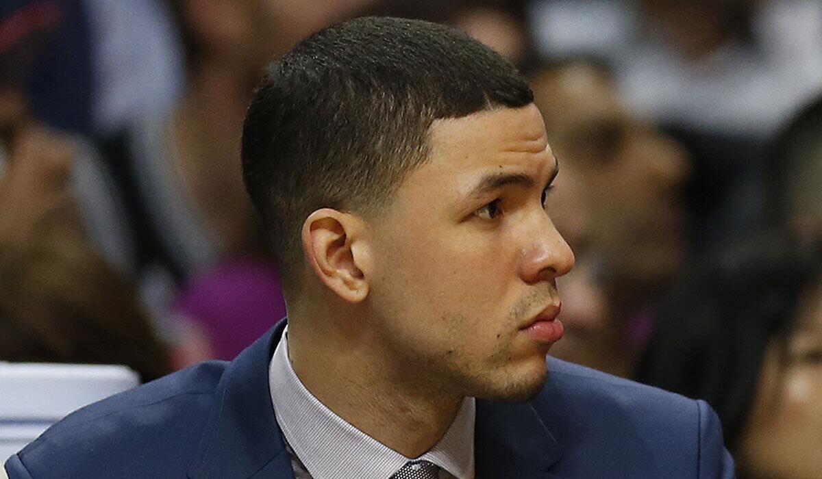 Austin Rivers watches from the Clippers bench during a game against the Spurs in San Antonio on Feb. 18.