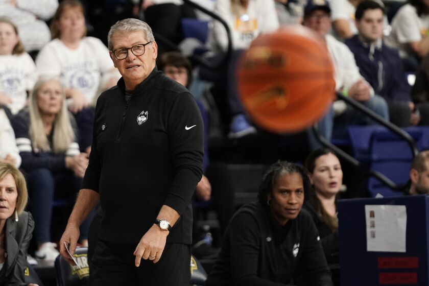 UConn head coach Geno Auriemma watches from the sideline during the second half of an NCAA college basketball game against Marquette Wednesday, Feb. 8, 2023, in Milwaukee. (AP Photo/Aaron Gash)