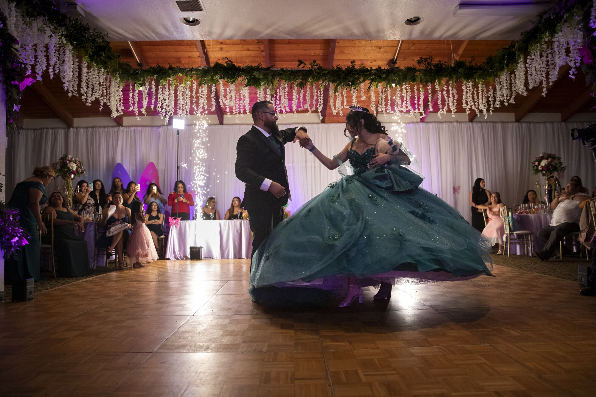 Cesar Ploneda dances with his stepdaughter Zoey Mary Jane Grande as they celebrate her quinceanera.