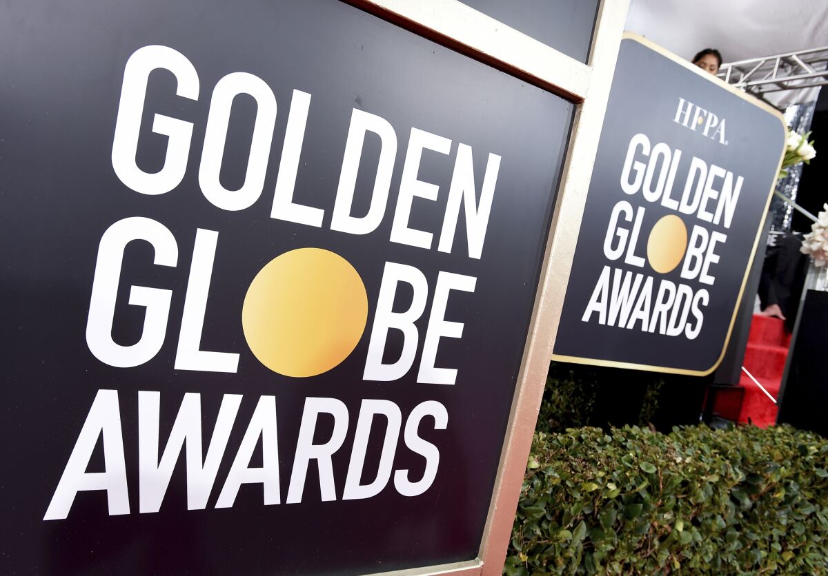 Golden Globes signage appears on the red carpet at the 76th annual Golden Globe Awards on Jan. 6, 2019, in Beverly Hills, Calif. A Norwegian entertainment reporter has sued the Hollywood Foreign Press Association, the organization that gives out the Golden Globe Awards, alleging that it acts as a cartel that stifles competition for its members. Reporter Kjersti Flaa filed the lawsuit in federal court in Los Angeles on Monday. Flaa said that despite reporting on Hollywood for many prominent Norwegian outlets, she has been repeatedly denied membership in the organization because the HFPA won't allow in new members whose work competes with that of existing ones. (Photo by Jordan Strauss/Invision/AP, File)