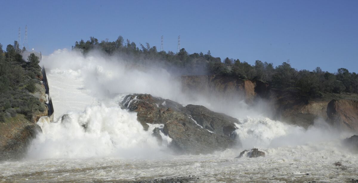 Water flows down Oroville Dam's main spillway in 2017.  (AP Photo/Rich Pedroncelli)