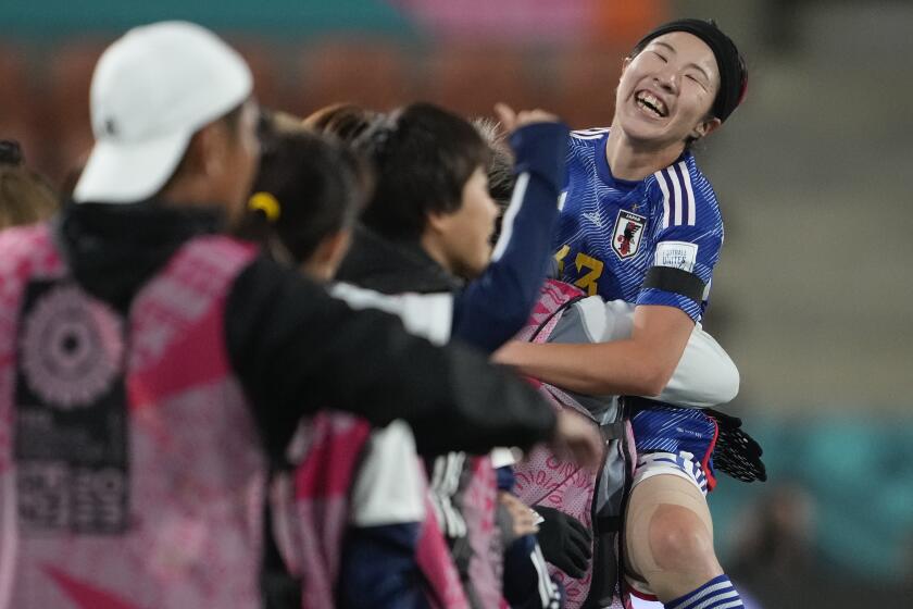 Japan's Jun Endo celebrates with her bench after scoring her team's fourth goal during the Women's World Cup Group C soccer match between Zambia and Japan in Hamilton, New Zealand, Saturday, July 22, 2023. (AP Photo/John Cowpland)