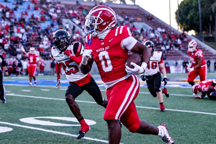 Jordon Davison of Mater Dei runs for a 44-yard touchdown against Corona Centennial.