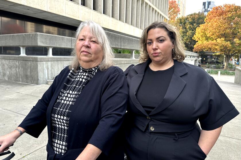 Daphne Muehlendorf and one of her daughters, Terra Khan, outside the Sacramento County Superior Court. 