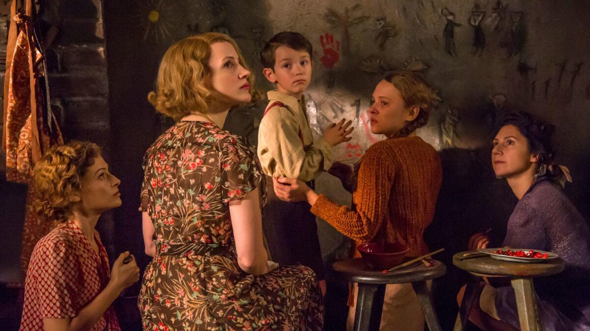 In the fact-based movie "The Zookeeper's Wife," Jessica Chastain, second from left, portrays the title character. Also pictured, from left: Efrat Dor, Timothy Radford, Shira Haas and Martha Issova. (Anne Marie Fox / Focus Features)