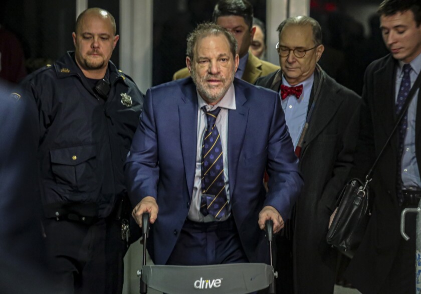 Harvey Weinstein, center, leaves Manhattan's Criminal Court after prosecutors completed their closing argument in his rape trial on Feb. 14.