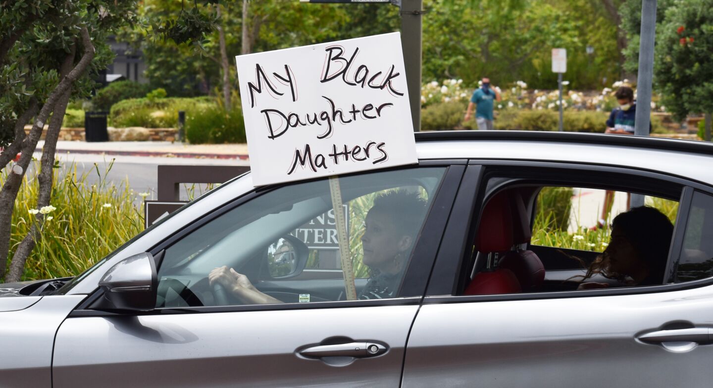 Some of the signs held up during the protest parade.