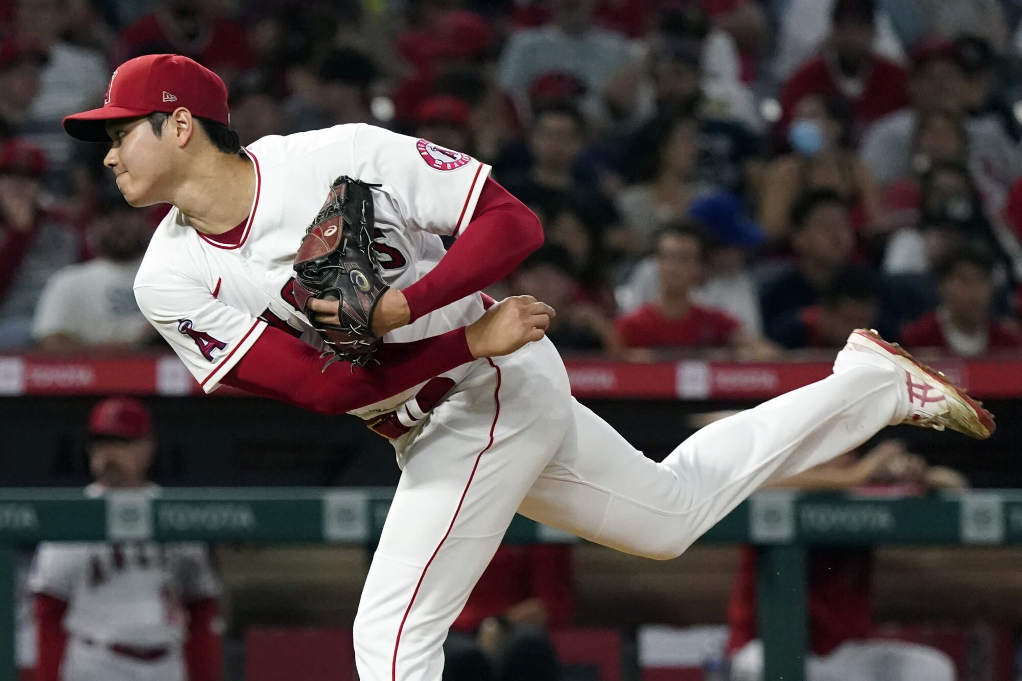 Angels pitcher Shohei Ohtani throws to a Toronto Blue Jays batter.