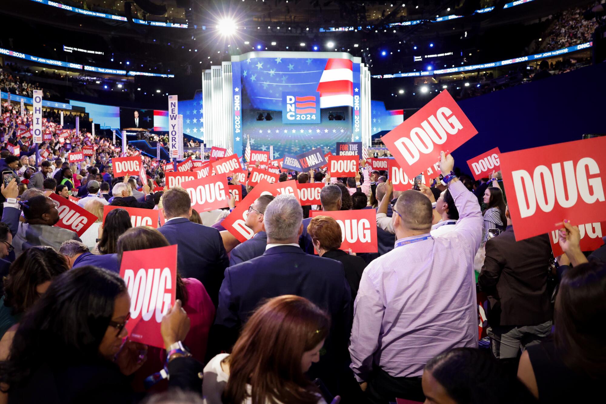 Delegates react to Second Gentleman Doug Emhoff's speech on Tuesday.