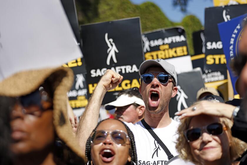BURBANK-CA-AUGUST 22, 2023: SAG-AFTRA and WGA join forces with the AFL-CIO and its affiliates from across the nation and across industries for a national day of solidarity rally outside of Disney Studios in Burbank on August 22, 2023, fighting for fair contracts, better compensation, safe working conditions and protections from encroaching technology. (Christina House / Los Angeles Times)