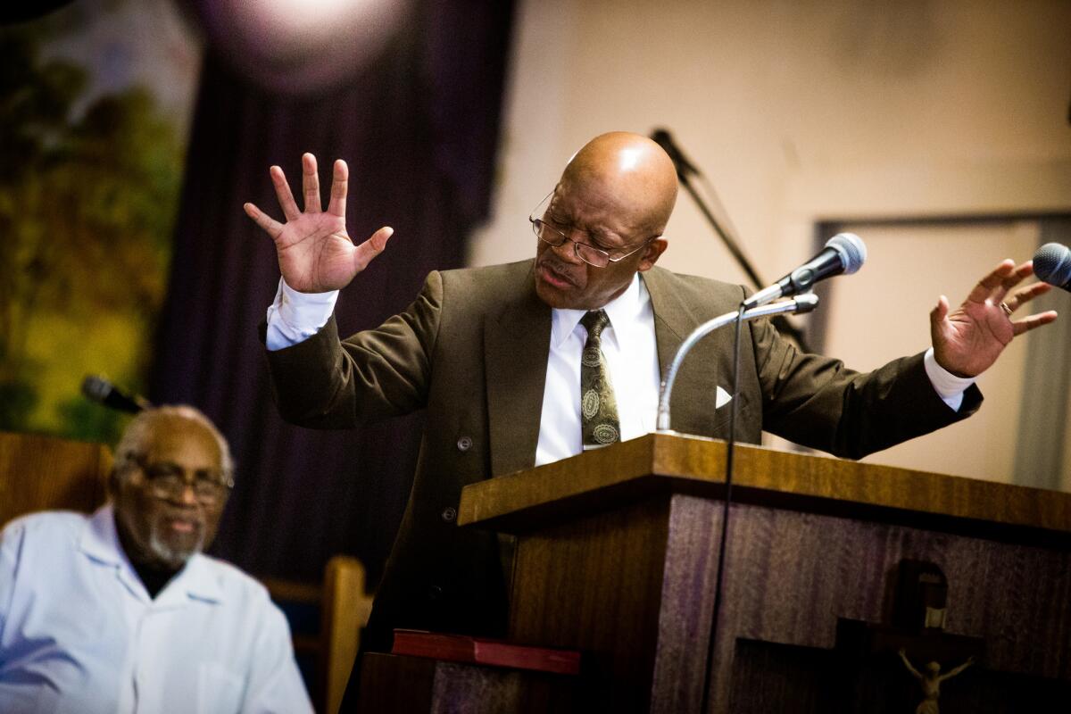 Dennis Hutson preaches to the small congregation at First Baptist Church in Pixley, Calif., in August.