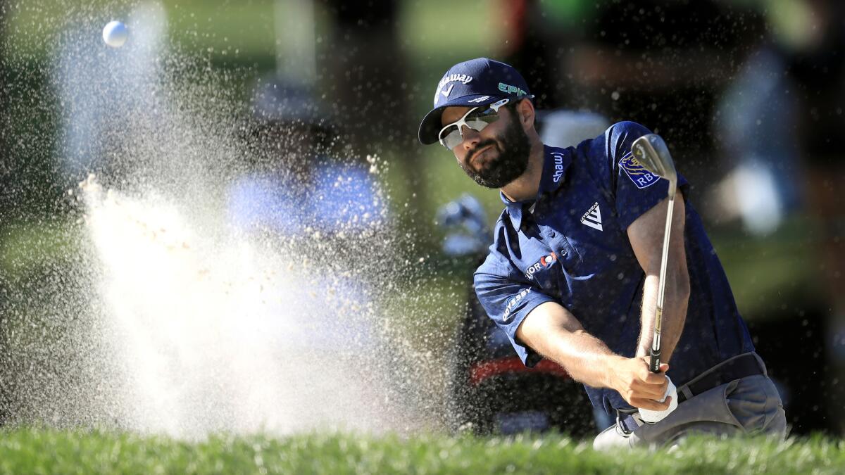 Adam Hadwin plays a bunker shot at No. 16 during the second round of the Valspar Championship on Friday.