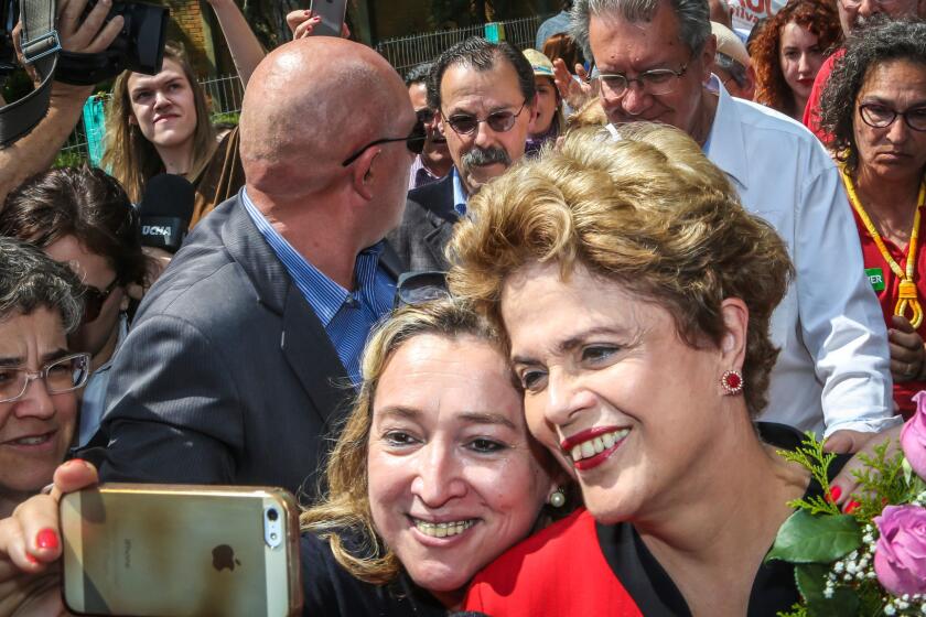 Former Brazilian President Dilma Rousseff with voters on Sunday, the day of municipal elections across Brazil.