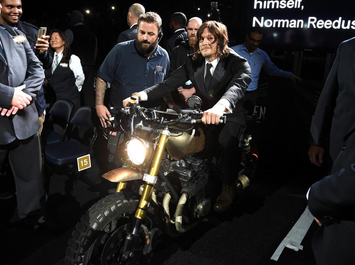 "The Walking Dead" star Norman Reedus sits astride a motorcycle at an fan premiere event for the AMC show's sixth season at Madison Square Garden on Oct. 9.