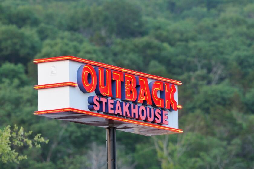 "Huntsville, Alabama, USA - June 9, 2011: Outback Steakhouse sign illuminated in the early evening. Sign located on Whitesburg Drive in Huntsville, Alabama."
