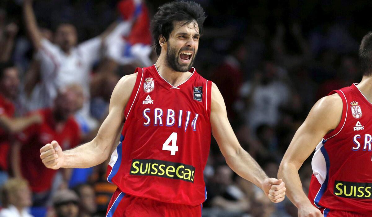 Serbia's Milos Teodosic celebrates after his team's 90-85 victory over France on Friday night at the Basketball World Cup