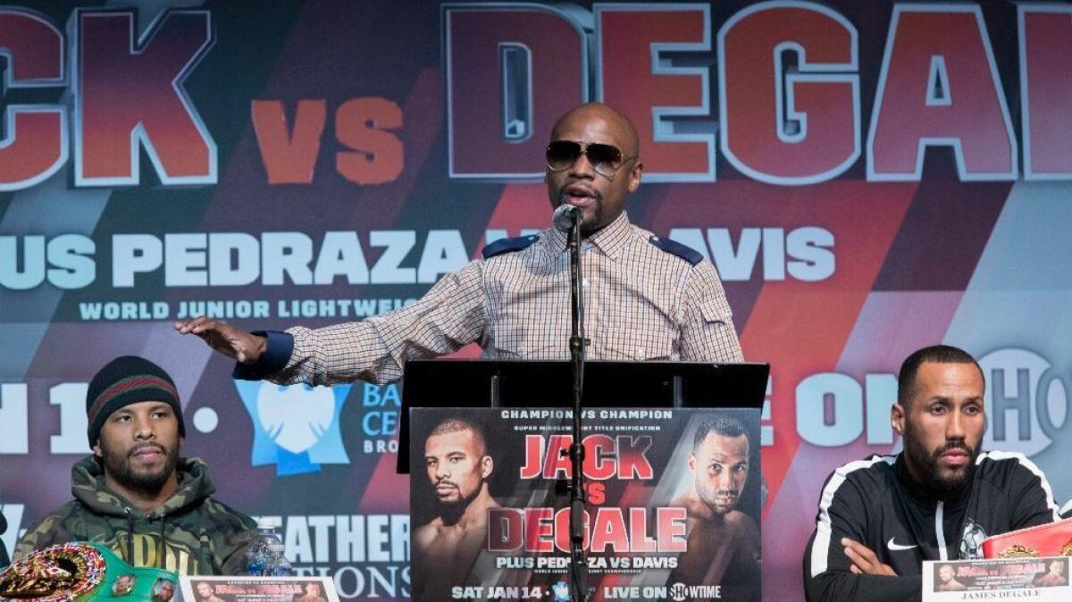 Retired boxer Floyd Mayweather Jr. speaks at a news conference in New York on Jan. 12 for a bout between James DeGale and Badou Jack.