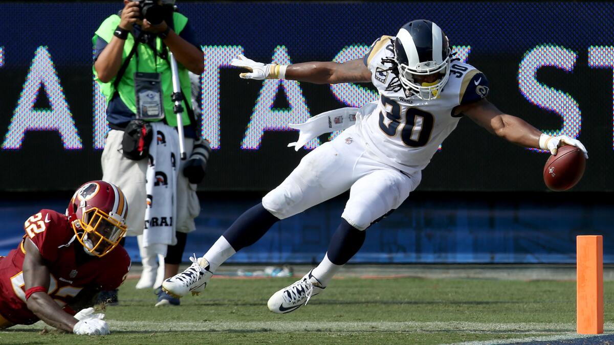 Rams running back Todd Gurley breaks the plane of the goal line to score a touchdown against the Redskins in the third quarter.