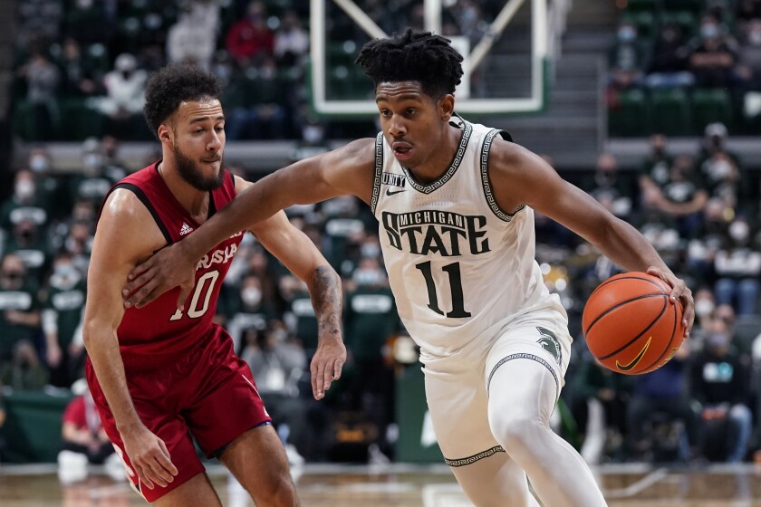 Michigan State guard A.J. Hoggard (11) drives as Nebraska guard Kobe Webster (10) defends during the second half of an NCAA college basketball game, Wednesday, Jan. 5, 2022, in East Lansing, Mich. (AP Photo/Carlos Osorio)
