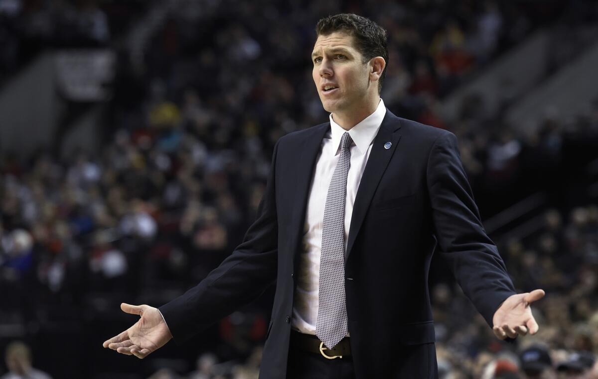 Golden State Warriors assistant coach Luke Walton gestures during the first half of the team's NBA basketball game against the Portland Trail Blazers in Portland, Ore. The Los Angeles Lakers have reached an agreement with Walton to become their head coach. The Lakers made the announcement Friday night, April 29, 2016, five days after firing Byron Scott.