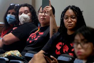 Long Beach, CA - California State University students with the grassroots group Students for Quality Education attend a meeting of the CSU Board of Trsutees in Long Beach on Tuesday, July 11, 2023. July 11: in Long Beach on Tuesday, July 11, 2023 in Long Beach, CA. (Luis Sinco / Los Angeles Times)