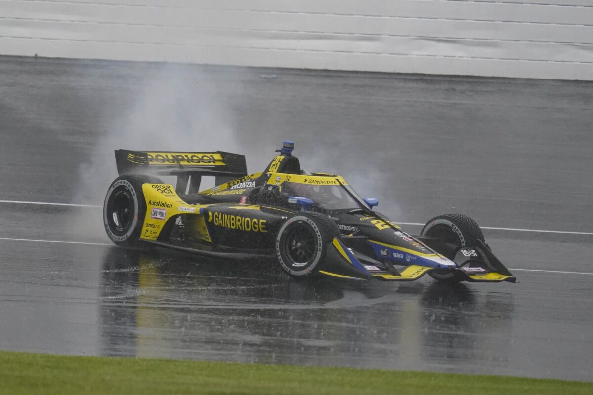 Colton Herta spins his car after winning the IndyCar GP auto race at Indianapolis Motor Speedway in Indianapolis, Saturday, May 14, 2022. (AP Photo/Michael Conroy)