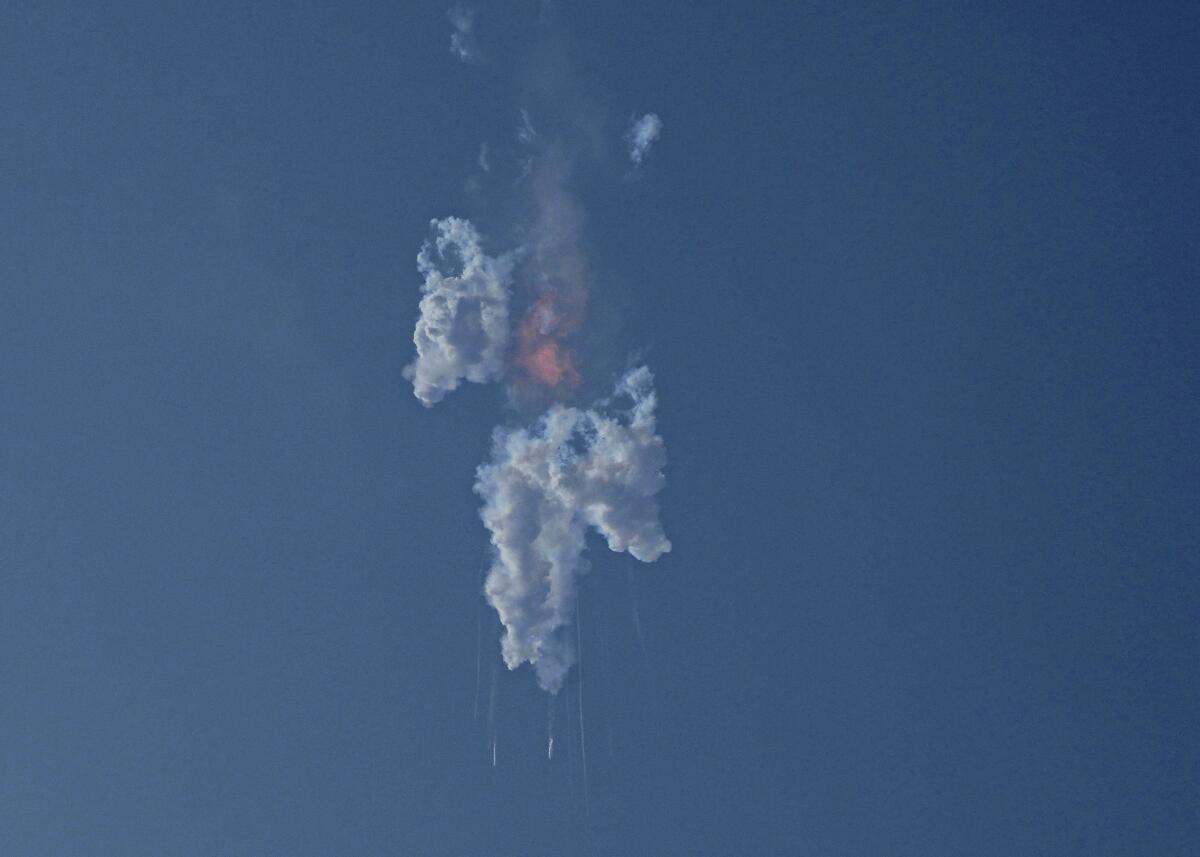 Rocket in air breaks up after an explosion 