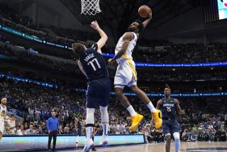 Golden State Warriors forward Andrew Wiggins (22) dunks the ball over Dallas Mavericks.