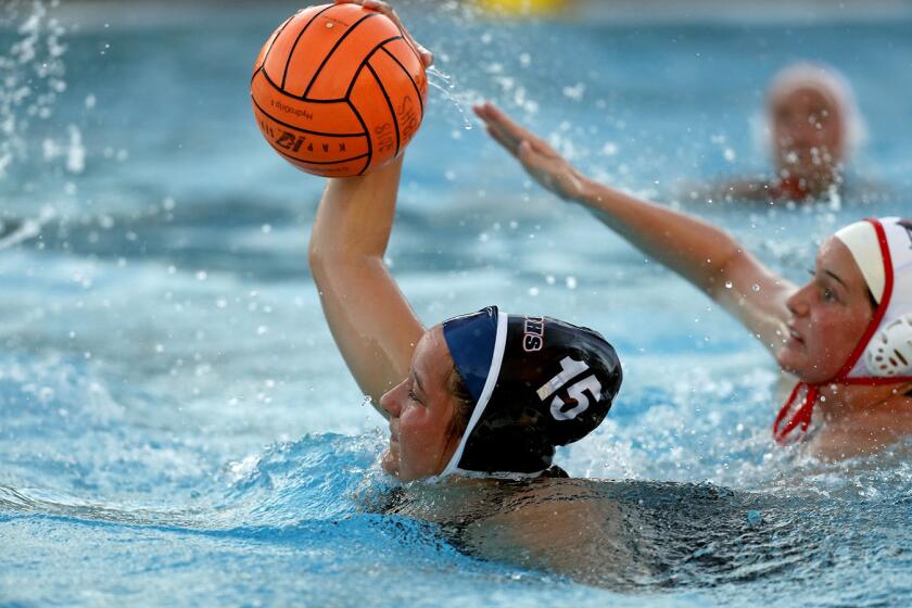 Shanna Davidson scores to give host Huntington Beach High an 11-10 lead in the first overtime against Murrieta Valley in the first round of the CIF Southern Section Division 2 playoffs on Wednesday.