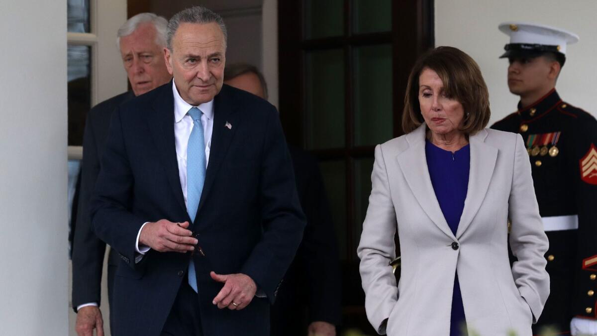 House Speaker Nancy Pelosi and Senate Minority Leader Charles E. Schumer exit the White House after meeting with President Trump to discuss the government shutdown on Friday.