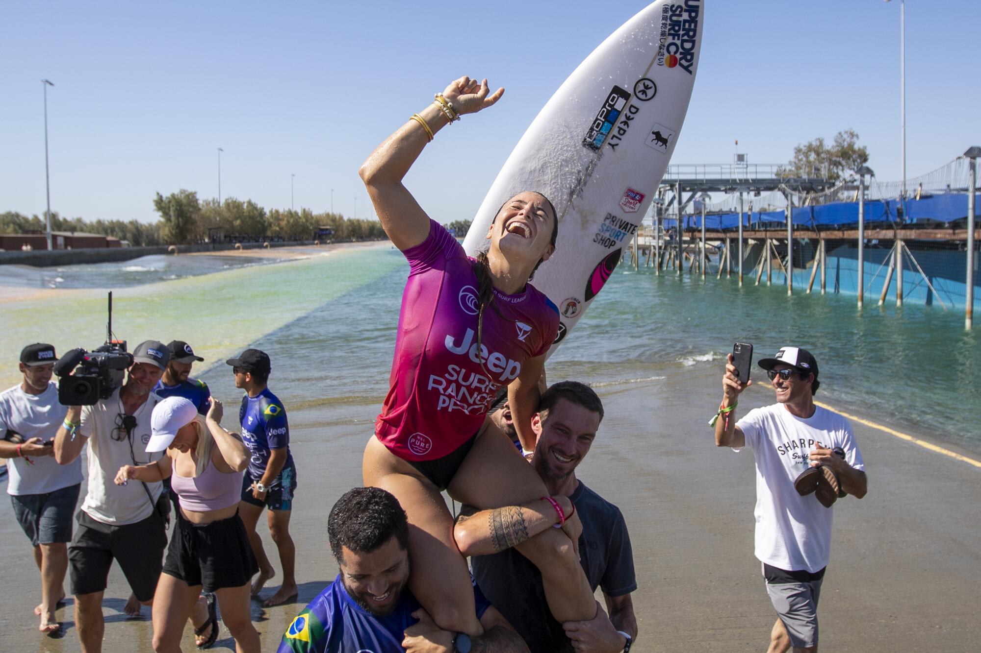 Johanne Defay of France gets a victory lift after she won the Jeep Surf Ranch Pro event June 20, 2021, in Lemoore, Calif. 