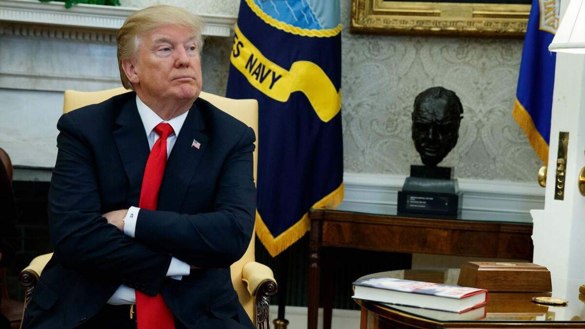 President Trump sits during a meeting where he talked with reporters about allowing the release of a secret memo on the FBI's role in the Russia inquiry in Washington on Feb. 2.