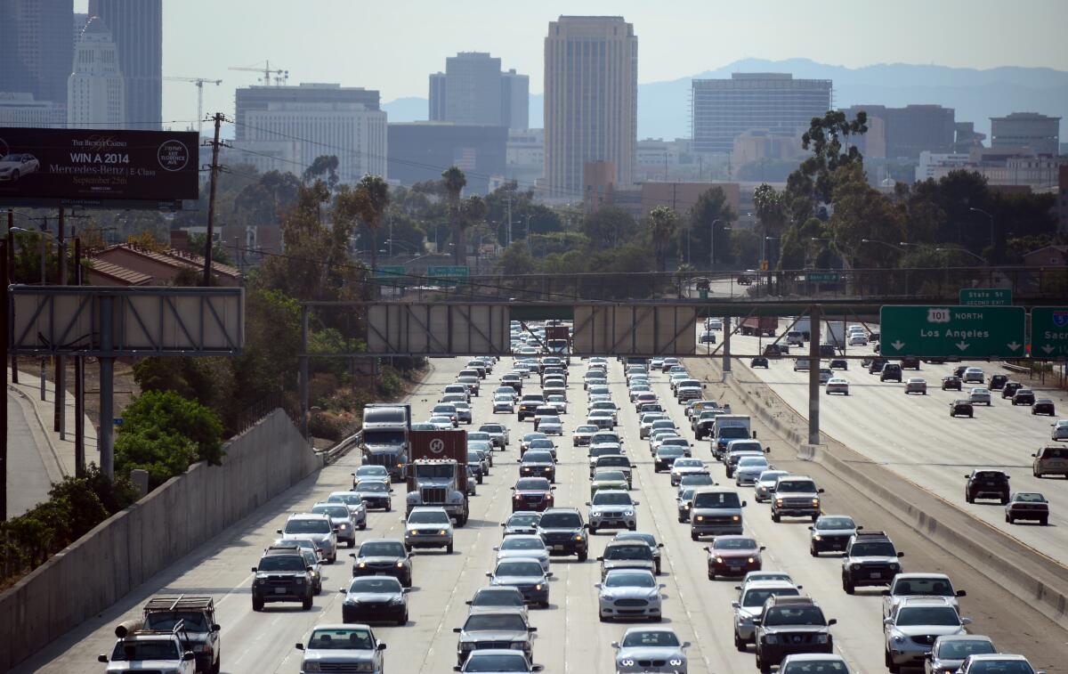 A traffic jam on a freeway with downtown Los Angeles in the background