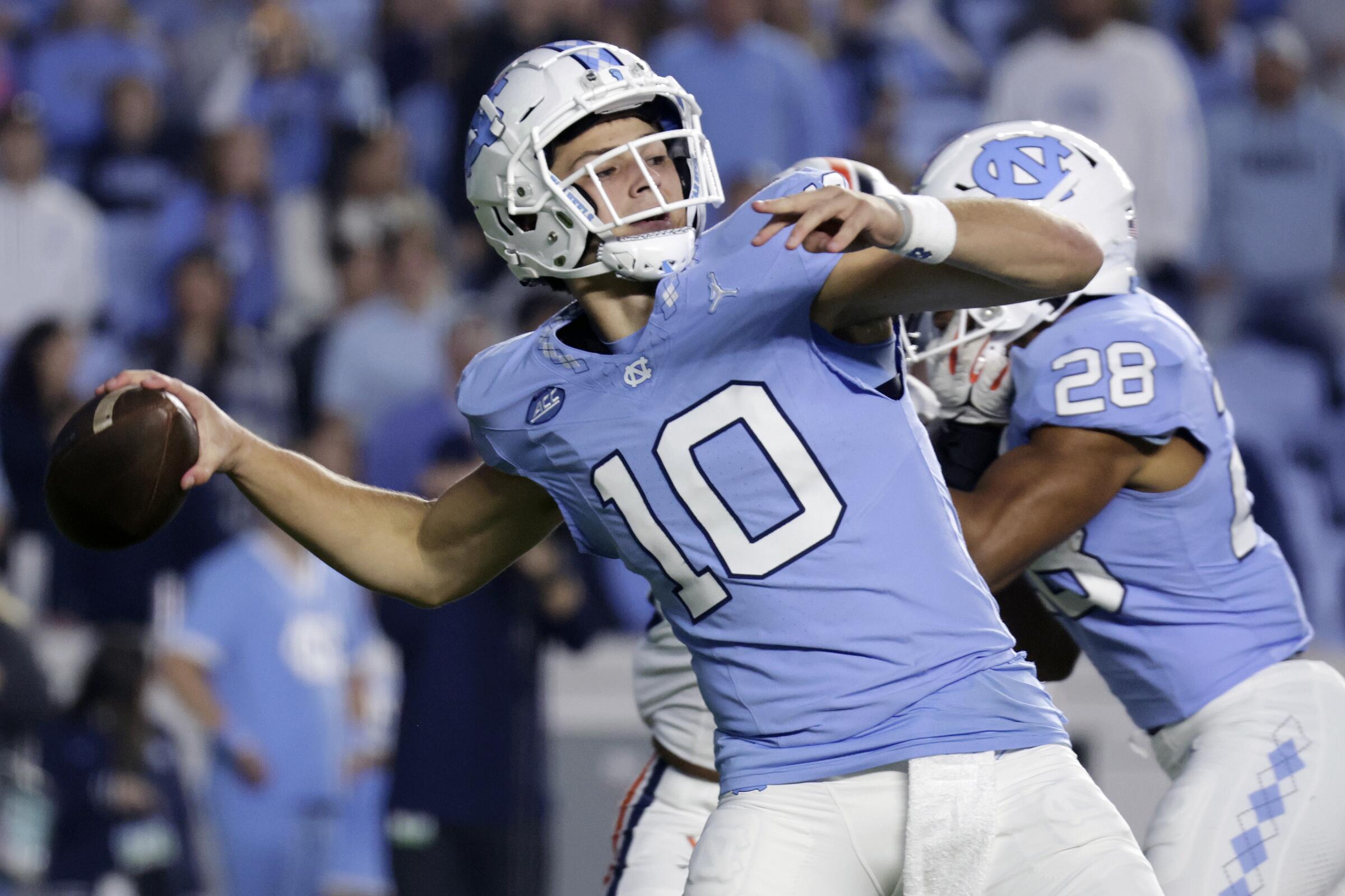 North Carolina quarterback Drake Maye reaches back before throwing a deep pass against Virginia in October.